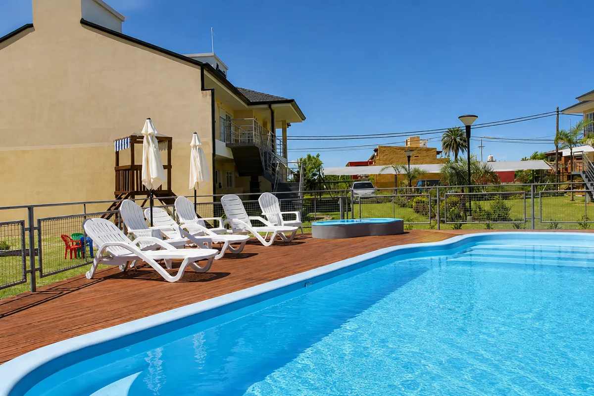 Outdoor swimming pool and sun loungers